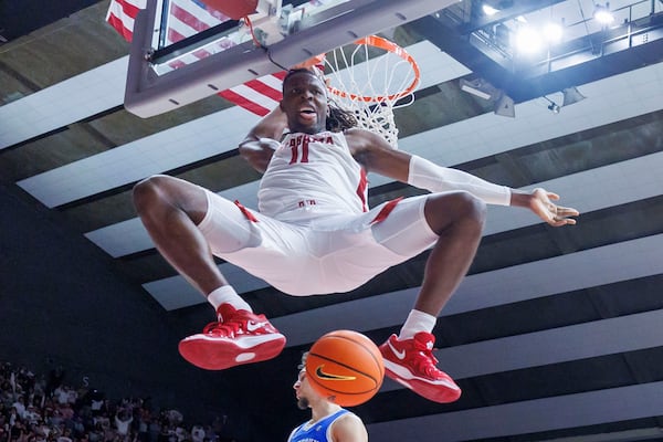 Alabama center Clifford Omoruyi (11) reacts after a dunk on Kentucky during the second half of an NCAA college basketball game, Saturday, Feb. 22, 2025, in Tuscaloosa, Ala. (AP Photo/Vasha Hunt)