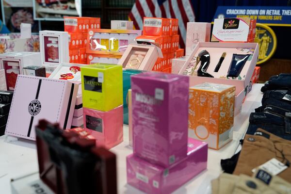 Stolen merchandise is displayed during a press conference on an international stolen merchandise ring, Tuesday, Nov. 26, 2024, in the Queens borough of New York. (AP Photo/Julia Demaree Nikhinson)