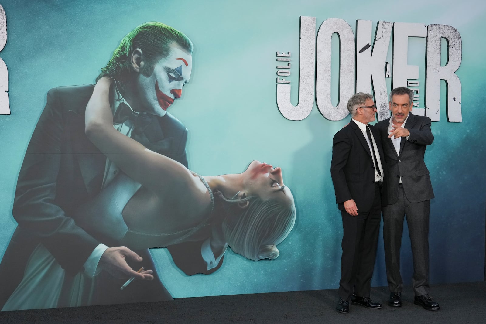 Joaquin Phoenix, left, and Todd Phillips arrive at the premiere of "Joker: Folie a Deux" on Monday, Sept. 30, 2024, at TCL Chinese Theatre in Los Angeles. (Photo by Jordan Strauss/Invision/AP)