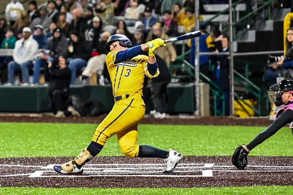 Savannah Bananas pitcher Eric Jones bats during the first home game of the season on Friday at Grayson Stadium in Savannah. Sarah Peacock for the AJC