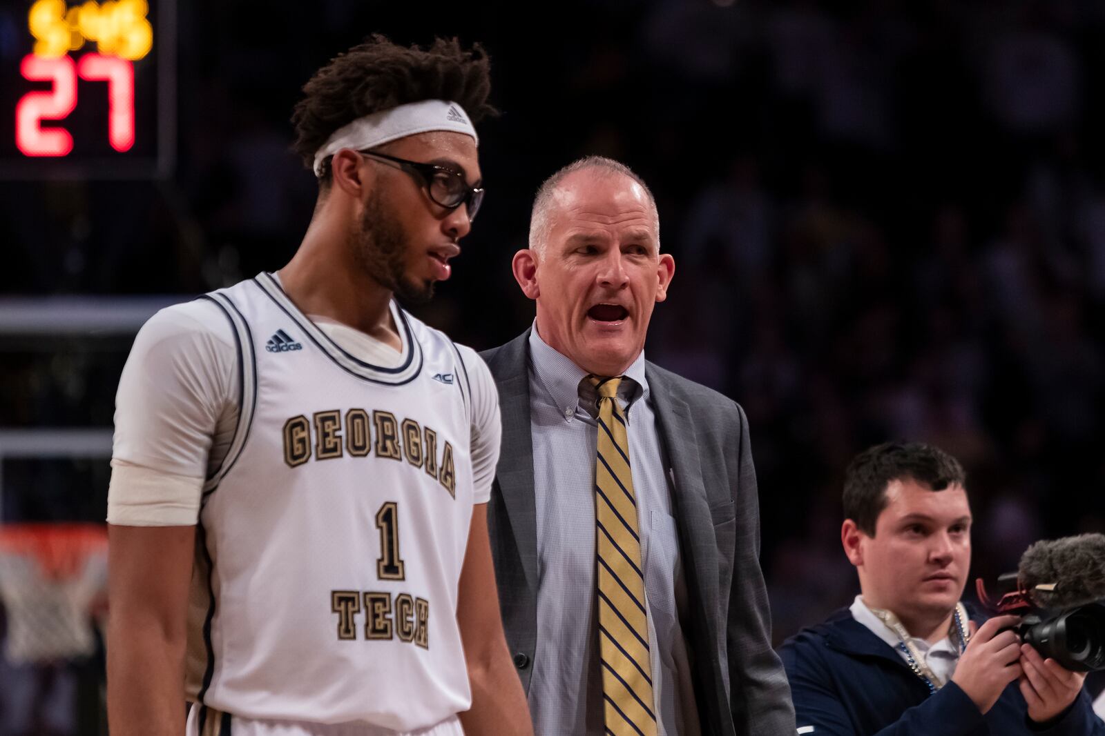 Georgia Tech assistant coach Eric Reveno with Yellow Jackets center James Banks during a Feb. 25, 2020 game at McCamish Pavilion.