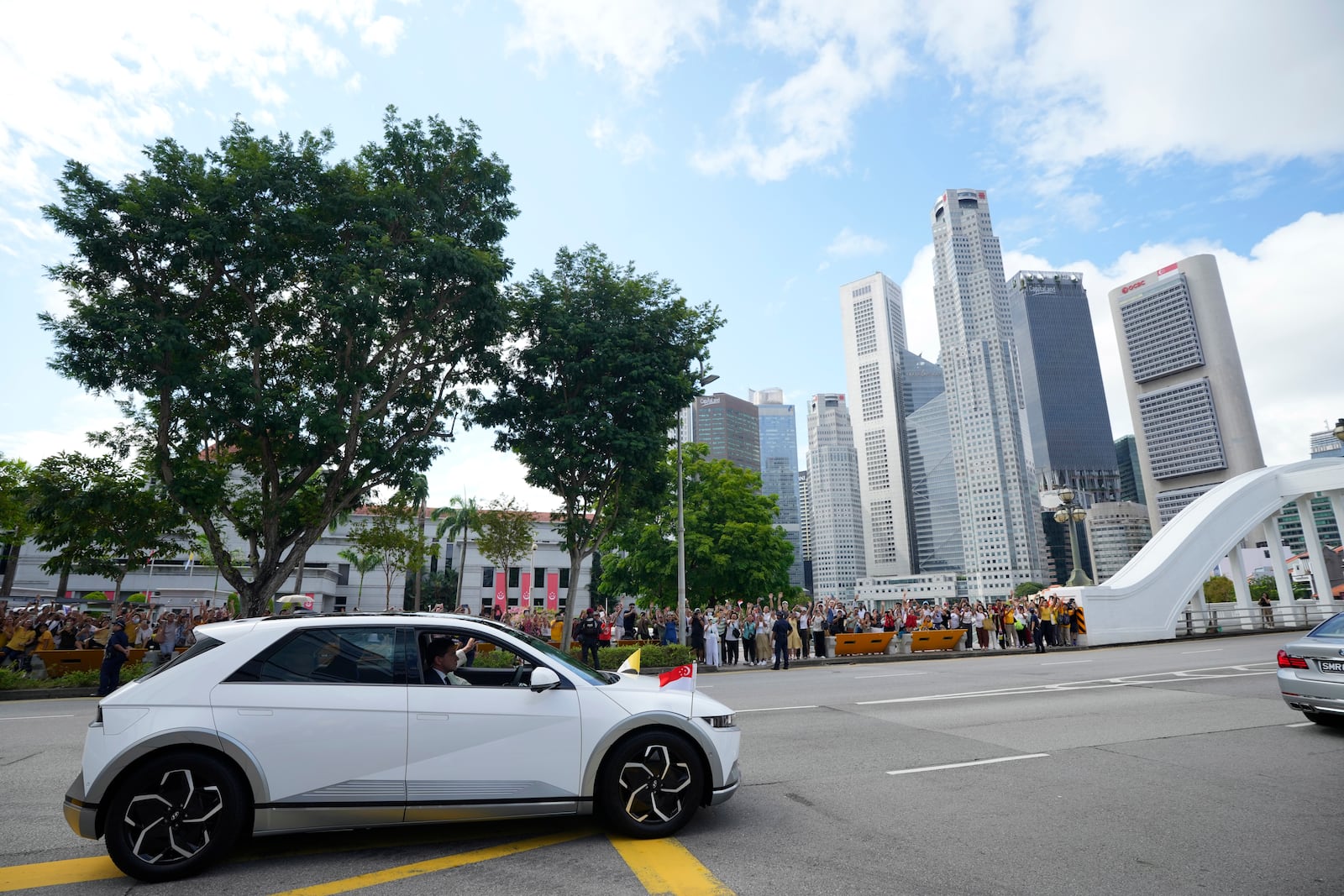 The car carrying Pope Francis leaves from the Parliament House in Singapore, Thursday, Sept. 12, 2024. (AP Photo/Vincent Thian)