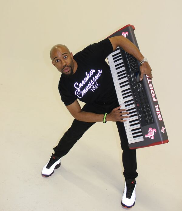 Hawks organist Sir Foster says he knows a couple of thousand songs and always "has one in the chamber." Photo: Melissa Ruggieri/AJC.