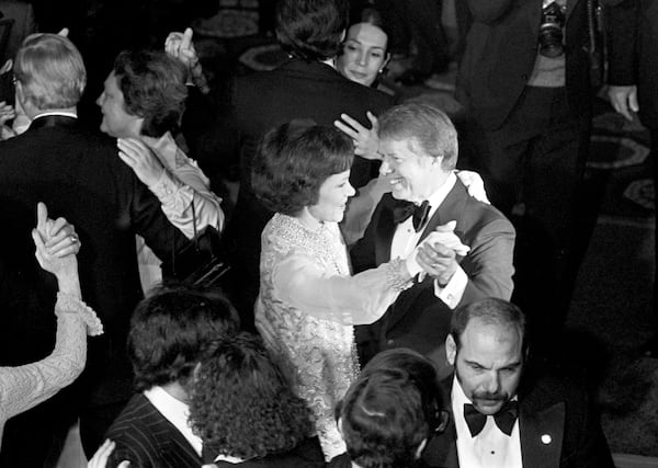 
                        FILE -- President Jimmy Carter and first lady Rosalynn Carter dance during an inauguration ball in Washington, Jan. 20, 1977. Carter, who rose from Georgia farmland to become the 39th president of the United States on a promise of national healing after the wounds of Watergate and Vietnam, then lost the White House in a cauldron of economic turmoil at home and crisis in Iran, died on Sunday, Dec. 29, 2024, at his home in Plains, Ga. He was 100. (Eddie Hausner/The New York Times)
                      