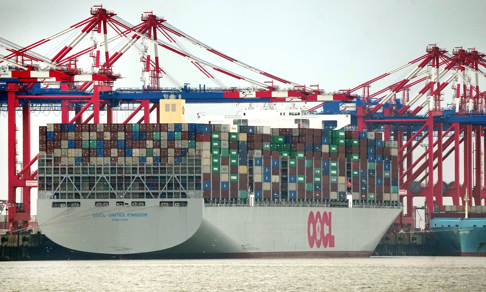 FILE - The 'OOCL United Kingdom' container vessel is anchored at the 'Jade Weserport' container terminal in Wilhelmshaven, Germany, Tuesday, Nov. 15, 2022. (AP Photo/Michael Sohn, File)