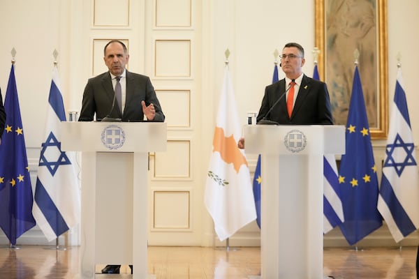 Greece' Foreign minister Giorgos Gerapetritis, speaks next to Israel's Foreign Minister Gideon Sa'ar, during a news conference and after trilateral meeting with Cyprus on energy cooperation in Athens, Thursday, March 13, 2025. (AP Photo/Petros Giannakouris)