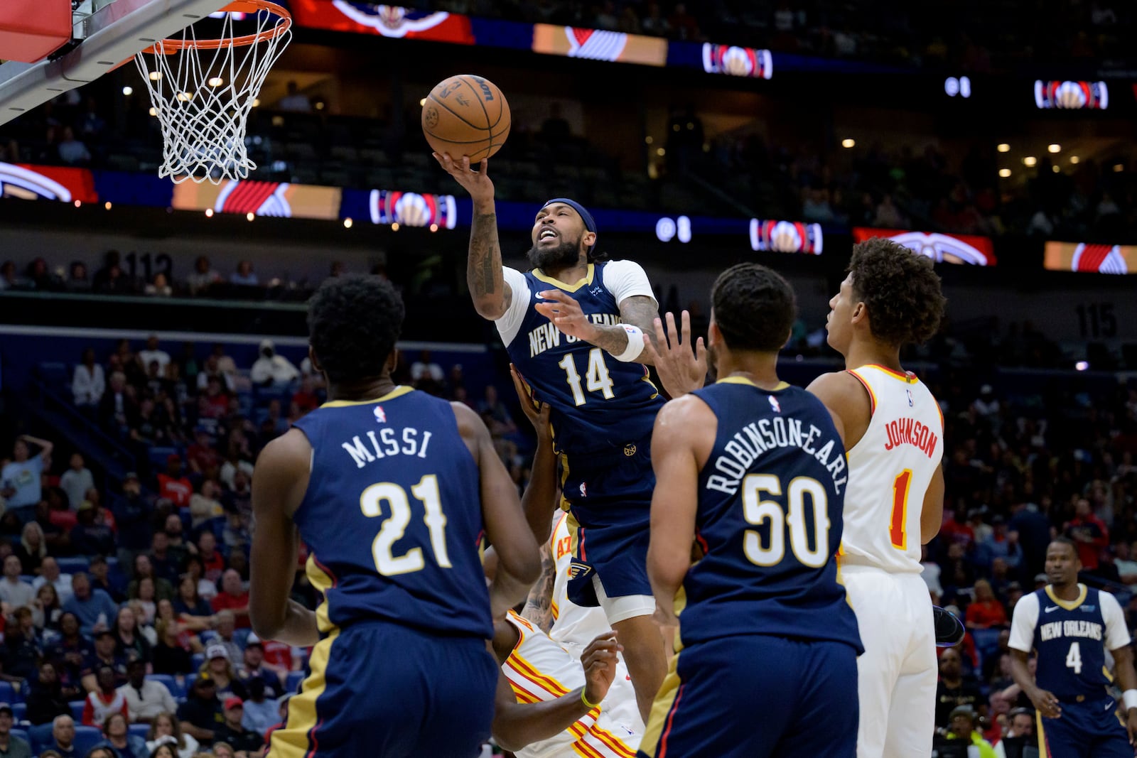 New Orleans Pelicans forward Brandon Ingram (14) shoots against the Atlanta Hawks during the first half of an NBA basketball game in New Orleans, Sunday, Nov. 3, 2024. (AP Photo/Matthew Hinton)