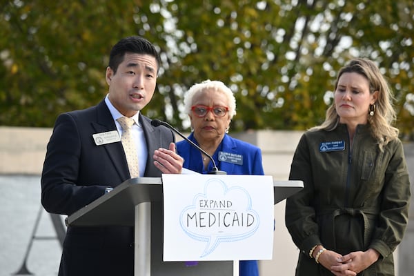 Rep. Sam Park, D-Lawrenceville, speaks as Sen. Gloria Butler, D-Stone Mountain (center) and Sen. Elena Parent, D-Atlanta, stand next to him during a press conference calling for full Medicaid expansion. (Hyosub Shin/hyosub.shin@ajc.com)