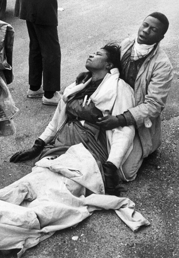 A civil rights marcher suffering from exposure to tear gas, holds an unconscious Amelia Boynton Robinson after mounted police officers attacked marchers in Selma, Alabama as they were beginning a 50 mile march to Montgomery to protest race discrimination in voter registration.