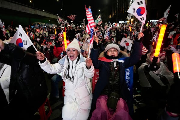 Supporters of impeached South Korean President Yoon Suk Yeol attend a rally to oppose his impeachment near the presidential residence in Seoul, South Korea, Saturday, March 8, 2025. (AP Photo/Ahn Young-joon)