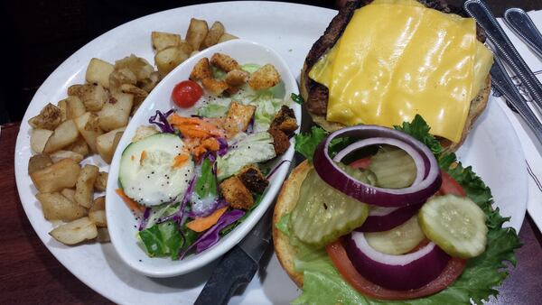 Photo credit: Grass-fed burger, salad and roasted potatoes at Egg Harbor Cafe. Carolyn Desalu.