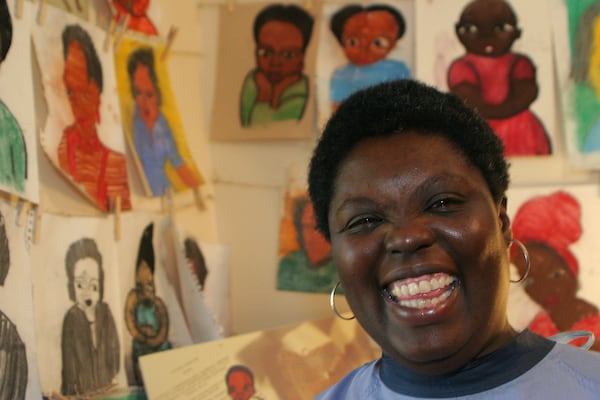 051031 PINE LAKE, GA:  Lois Curtis, a mentally disabled artist, is surrounded by her paintings in her Pine Lake studio on Monday, October 31, 2005.  Curtis won a U.S. Supreme Court case freeing disabled people from state-run institutions.  Currently, Curtis is working on her one-woman art show at Temple Gallery in downtown Decatur which starts November 9, 2005.   PHOTO BY JESSICA MCGOWAN/SPECIAL