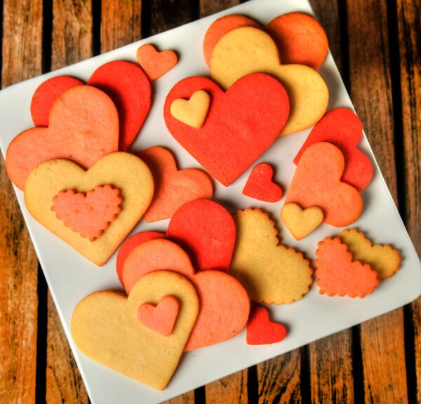 With food coloring and different-sized cookie cutters, you can make an assortment of the Orange Sugar Cookies developed by Canoe pastry chef Jessica McKinney. (Styling by Jessica McKinney / Chris Hunt for the AJC)