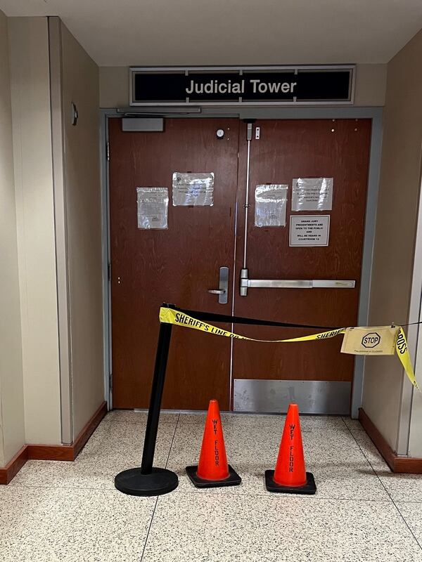 Tape and cones block off entrance to the judicial tower at the DeKalb County courthouse on Wednesday, Jan. 11, 2023, nearly two weeks after burst pipes caused flooding.