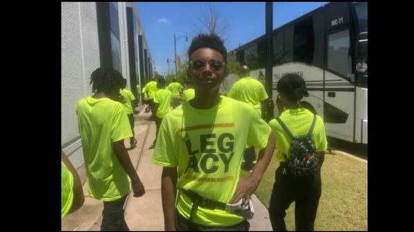 Joshua Pinson, 13, a rising eighth grader at DeKalb Agriculture Technology and Environment, Inc., poses for a picture outside the Legacy Museum in Montgomery, Alabama, on Friday, June 16, 2023. Pinson was one of several dozen DeKalb County students who visited the museum as part of a summer program aimed at helping Black male middle school students make good decisions inside and outside the classroom. (Eric Stirgus/eric.stirgus@ajc.com)