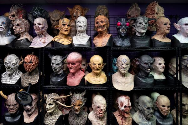 Full-face masks line the shelves at Netherworld haunted house in Stone Mountain on Friday, Oct. 25, 2024.   Ben Gray for the Atlanta Journal-Constitution