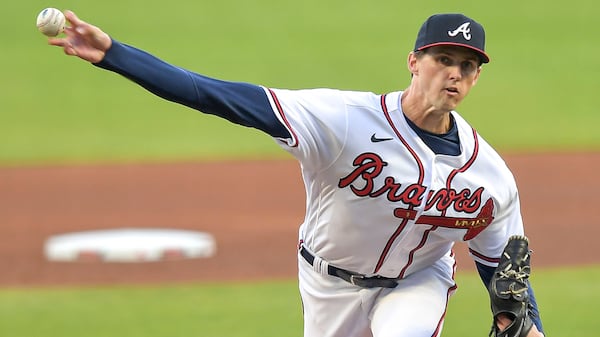 Braves starting pitcher Kyle Wright (30) delivers against the Reds in the first inning Tuesday, April 11, 2023 at Truist Park in Atlanta. (Daniel Varnado / For the AJC)