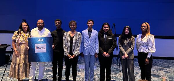 Frank Ski with his wife, Dr. Patrice Basanta-Henry (L) and student winners of his annual contest to join the Frank Ski Kids Foundation's yearly environmental education trip.