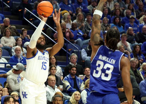 Kentucky's Ansley Almonor (15) looks to shoot while defended by Georgia State's Nick McMullen (33) during the first half of an NCAA college basketball game in Lexington, Ky., Friday, Nov. 29, 2024. (AP Photo/James Crisp)