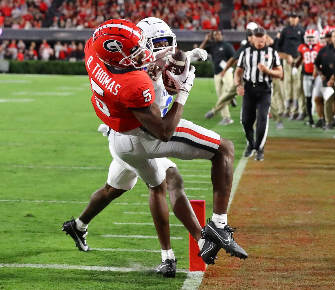 Georgia wide receiver Rara Thomas catches a touchdown pass past Kentucky defensive back Maxwell Hairston for a 14-0 lead during the first quarter.   Curtis Compton for the Atlanta Journal Constitution