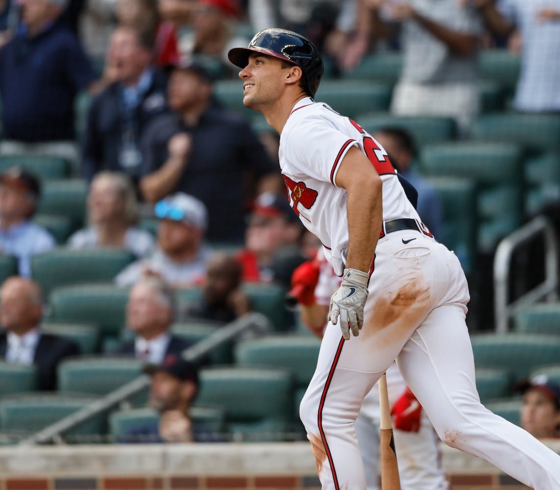 Atlanta Braves' Matt Olson hits a three-run homer during the ninth inning of game one of the baseball playoff series between the Braves and the Phillies at Truist Park in Atlanta on Tuesday, October 11, 2022. (Jason Getz / Jason.Getz@ajc.com)