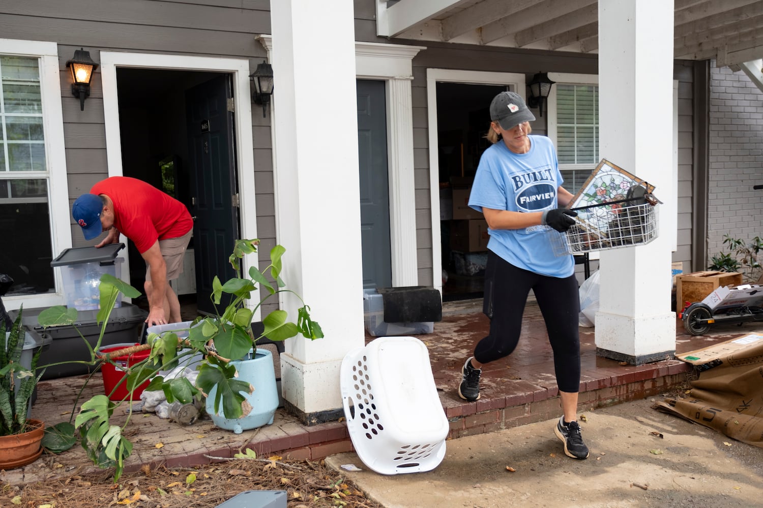 Dexter and Kerri Leach help their daughter move out of her flooded apartment at the Peachtree Park Apartments in Atlanta on Saturday, Sept. 28, 2024.   Ben Gray for the Atlanta Journal-Constitution