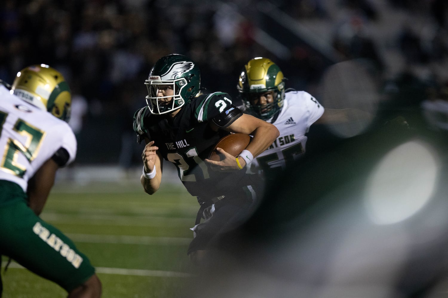 Collins Hill quarterback Sam Horn (21) runs the ball during a GHSA high school football game between the Collins Hill Eagles and the Grayson Rams at Collins Hill High in Suwanee, GA., on Friday, December 3, 2021. (Photo/ Jenn Finch)