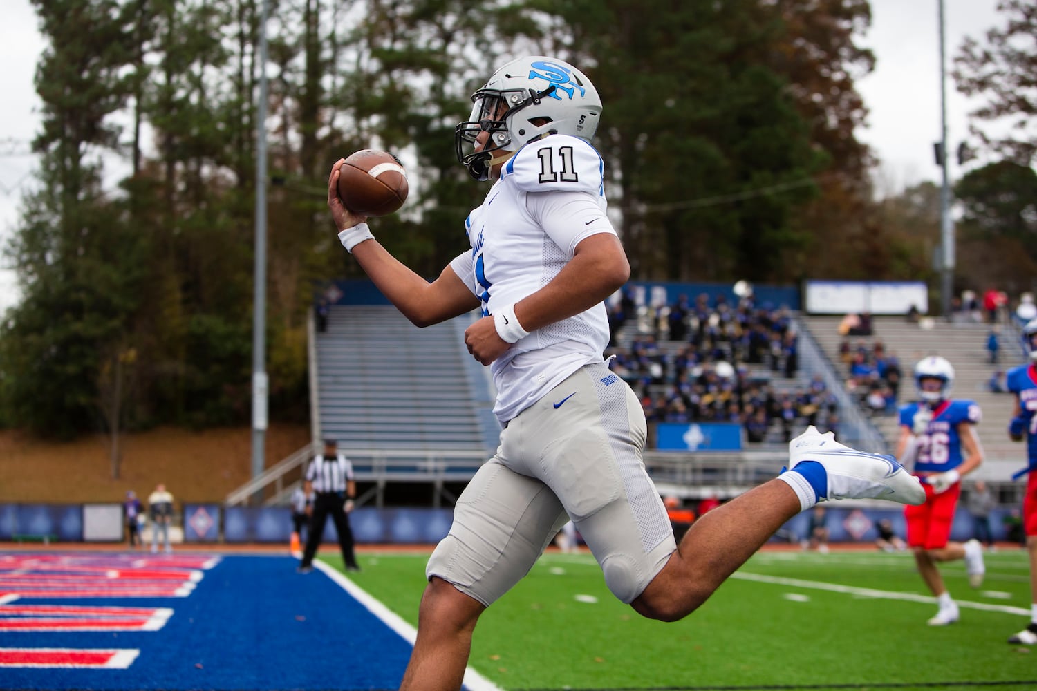 Ty Watkins, quarterback for South Forsyth, runs the ball. CHRISTINA MATACOTTA FOR THE ATLANTA JOURNAL-CONSTITUTION.