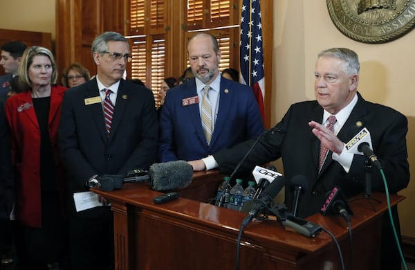 Secretary of State Brad Raffensperger, from left, Rep. Barry Fleming, R - Harlem, and House Speaker David Ralston answer questions after the passage of a bill to buy a $150 million election system that includes a paper ballot printed with a ballot marking device.  Bob Andres / bandres@ajc.com