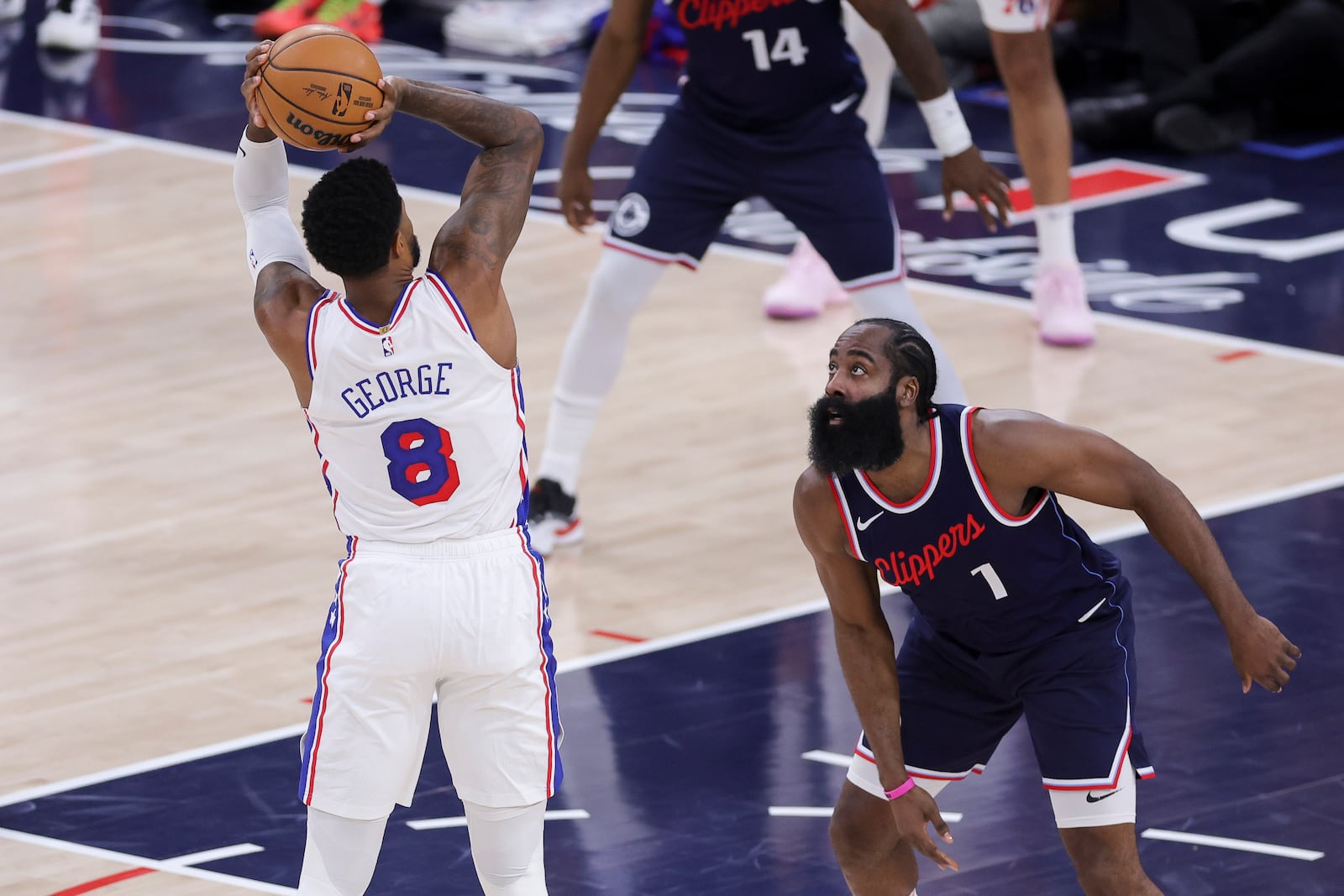 Philadelphia 76ers forward Paul George (8) shoots against Los Angeles Clippers guard James Harden (1) during the first half of an NBA basketball game, Wednesday, Nov. 6, 2024, in Inglewood, Calif. (AP Photo/Ryan Sun)