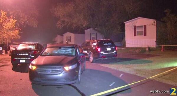 Investigators collected evidence at a mobile home on Willow Lane where a child was fatally shot Thursday night.