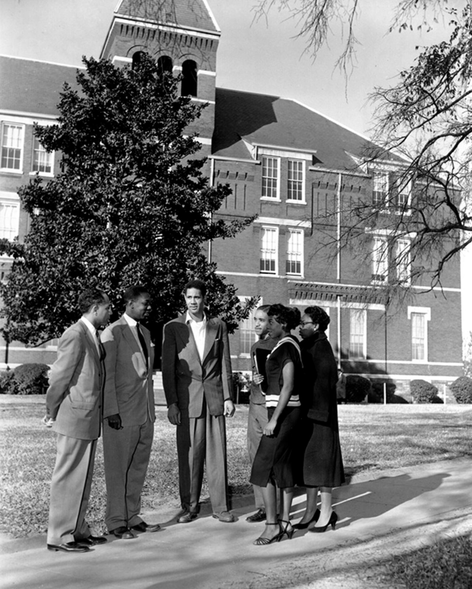 A group of people talk on the grounds of Morris Brown College in Atlanta, Ga., in this undated photo. Standing from left to right are, Dean Albert Whiting; William Gordon, an instructor at the black college; Ralph Geer; Frederick Hall; Mary Ann Lewis; and Sallie Ivery. (AP Photo)