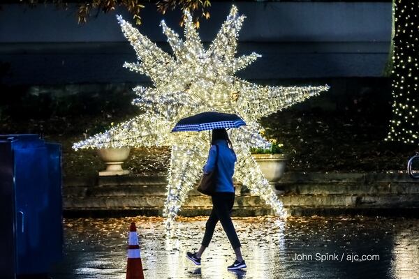 Umbrellas came out early Thursday  in front of the Norfolk Southern building at 1200 Peachtree Street.