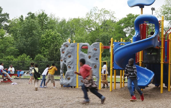 Children play on the playground at Dobbs Elementary School in Atlanta on Wednesday, May 1, 2019. EMILY HANEY / emily.haney@ajc.com