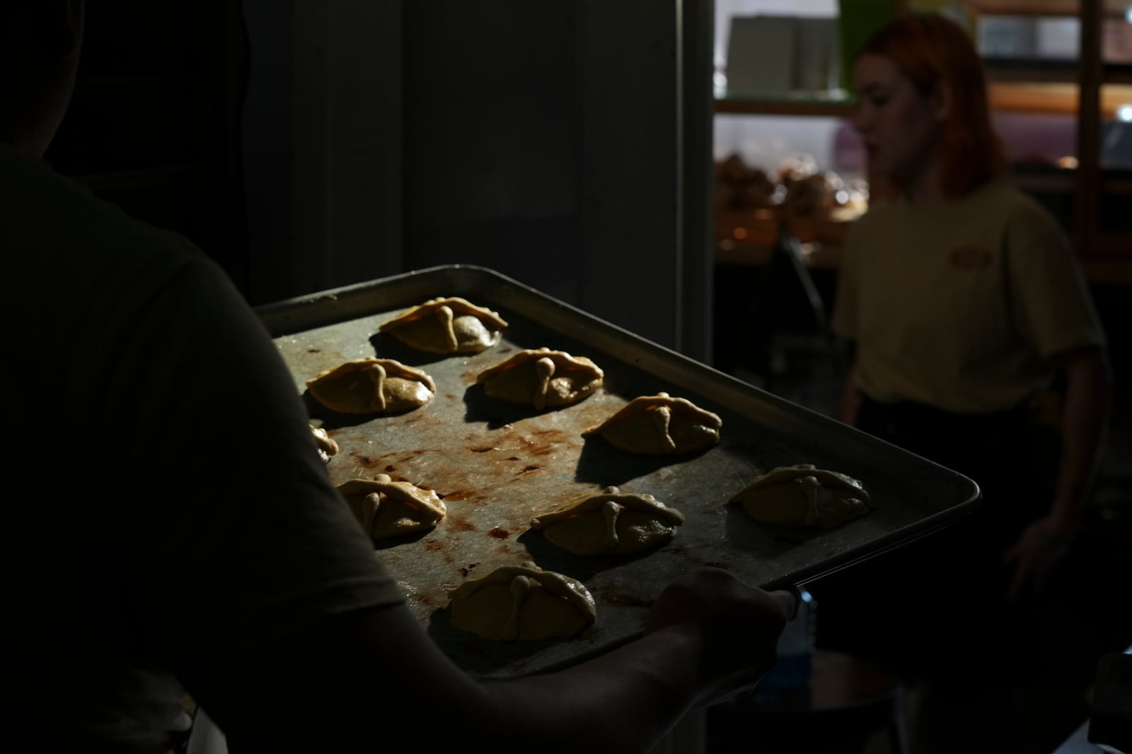 Victor Silverio prepares pan de muerto, or "bread of the dead," traditional for Mexico's Day of the Dead, at a bakery in the San Rafael neighborhood of Mexico City, Thursday, Oct. 17, 2024. (AP Photo/Fernando Llano)