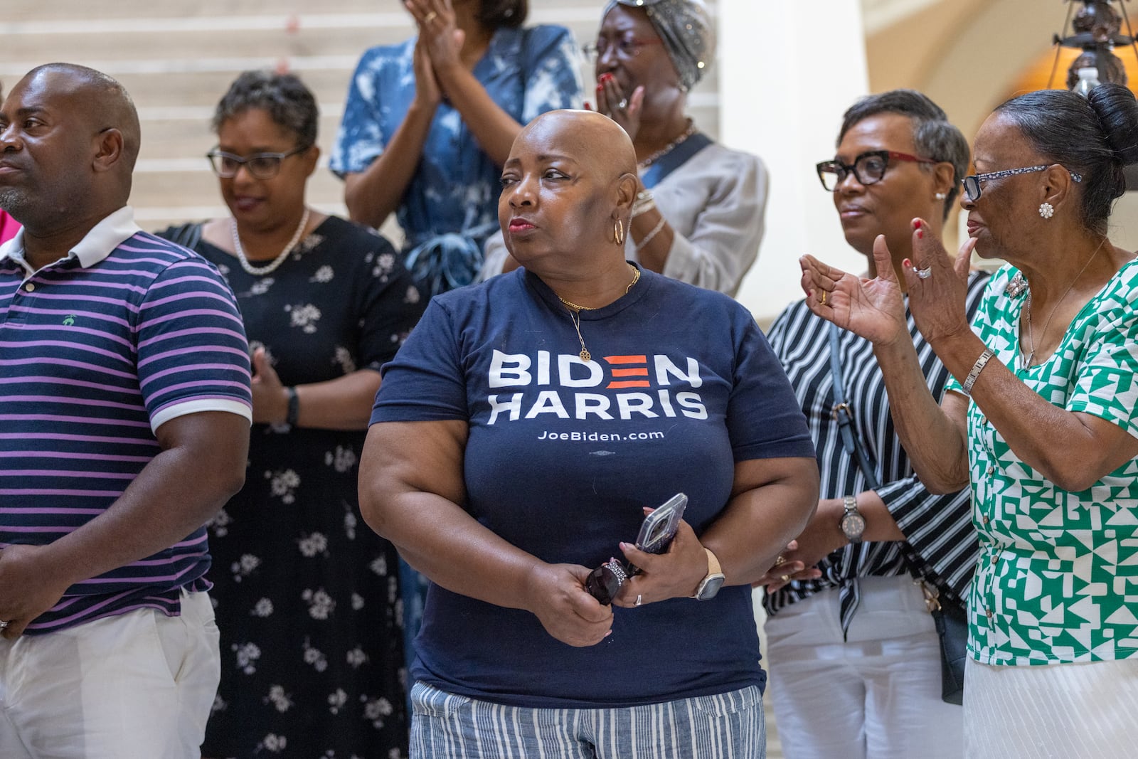 Leah Foster (center), a member of Flipper Temple AME church, stands in support at a press conference for Black clergy showing solidarity for Joe Biden at the Capitol in Atlanta on Thursday, July 11, 2024. (Arvin Temkar / AJC)