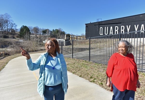 Genia Billingsley and her mother talk as they take a walk on the Proctor Creek Greenway in Grove Park. (Hyosub Shin / Hyosub.Shin@ajc.com)