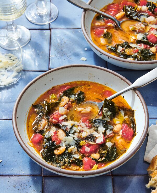 Tomato and Greens Minestrone owes its velvety consistency and extra layer of umami flavor to a stock made by simmering Parmesan rinds saved in the freezer. Courtesy of Lauren Vied Allen