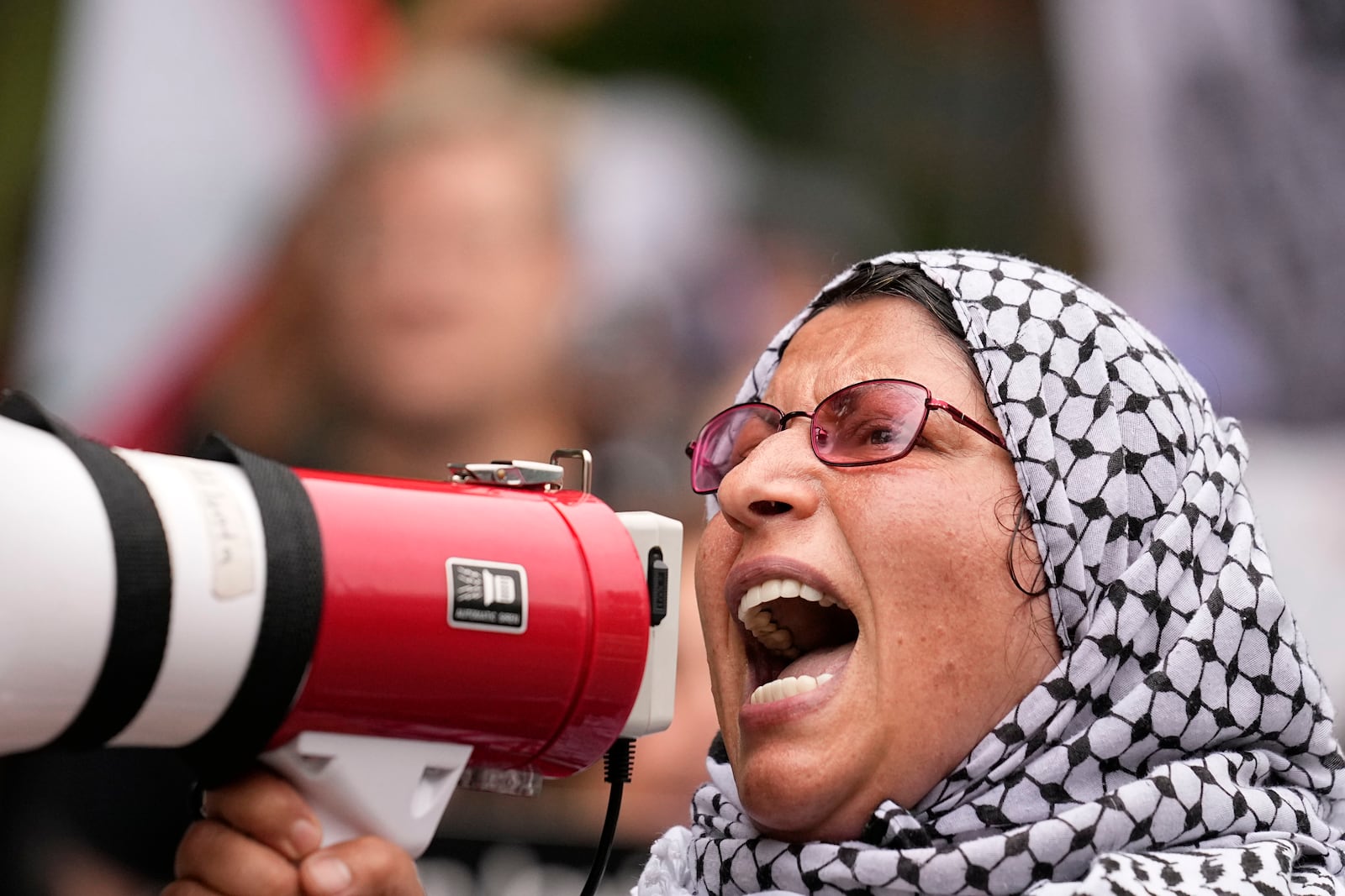 FILE - A pro-Palestinian supporter protests near the commencement at Morehouse College, May 19, 2024, in Atlanta. (AP Photo/Brynn Anderson, File)