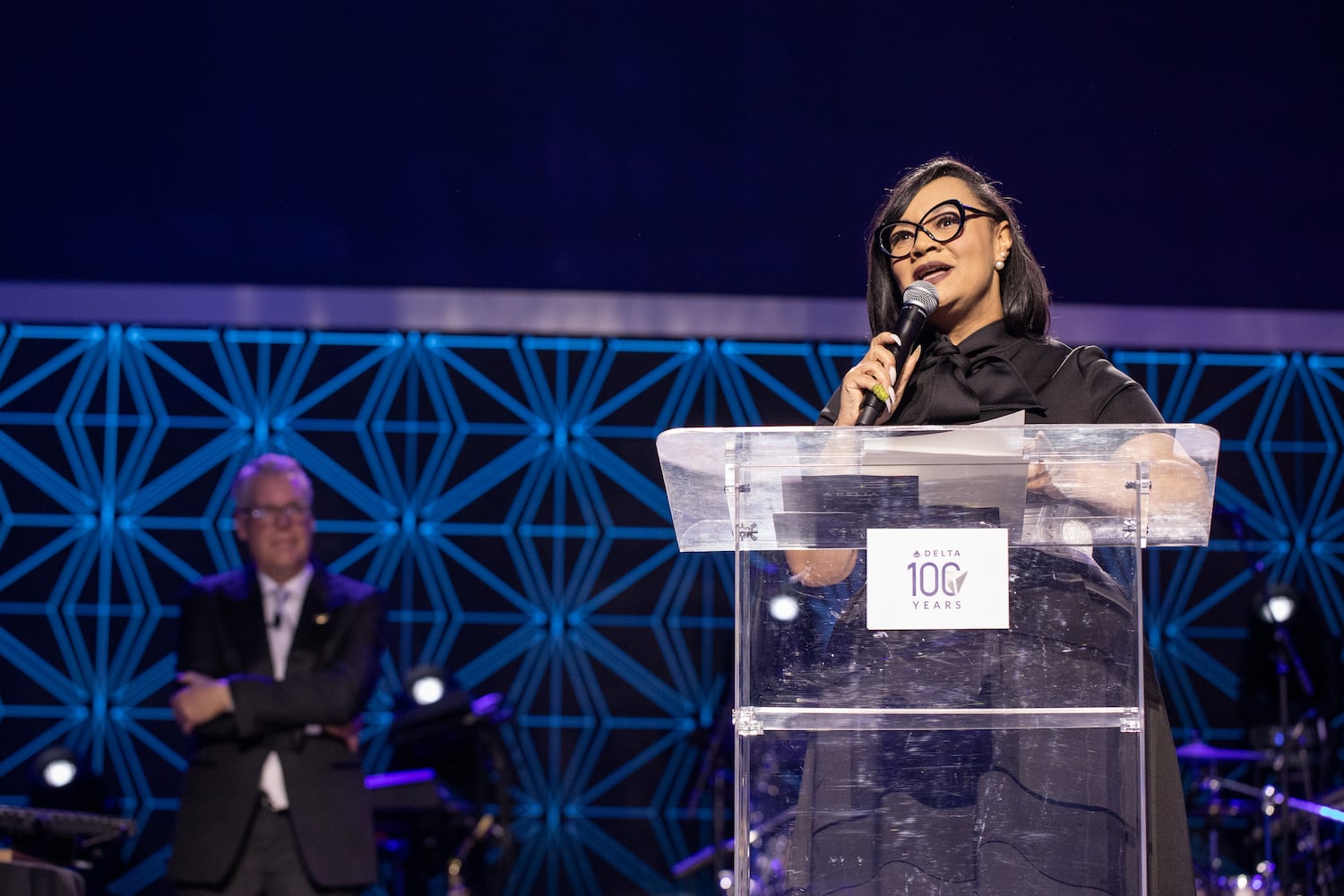 Delta Airlines celebrates it's 100 year anniversary on Saturday, March 15, 2025 at the Delta Flight Museum. Congressional Representative Nikema Williams, who represents Delta’s district, addresses the crowd at the gala. (Jenni Girtman for The Atlanta Journal-Constitution)