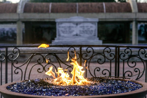 An eternal flame burns at the tomb of the Rev. Martin Luther King Jr. and his wife, Coretta Scott King, on Jan. 20, 2020, in Atlanta. BRANDEN CAMP / SPECIAL TO THE AJC