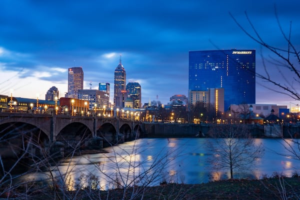 A view from White River State Park takes in the skyline of downtown Indianapolis and the pedestrian bridge spanning the river. Photos: Visit Indy