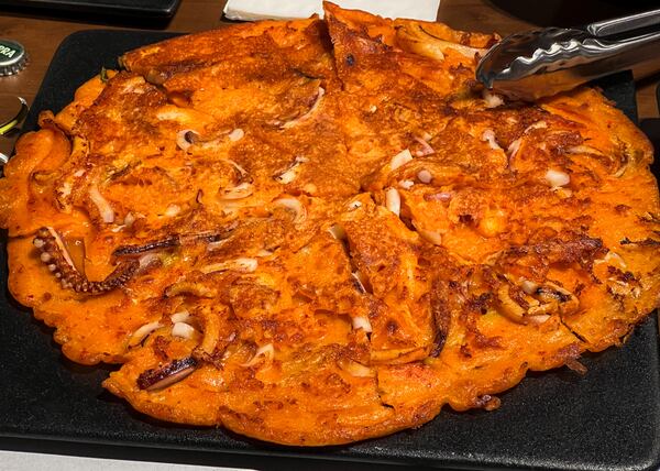 You can get a kimchi pancake with squid at Dubu Gongbang. Henri Hollis/henri.hollis@ajc.com