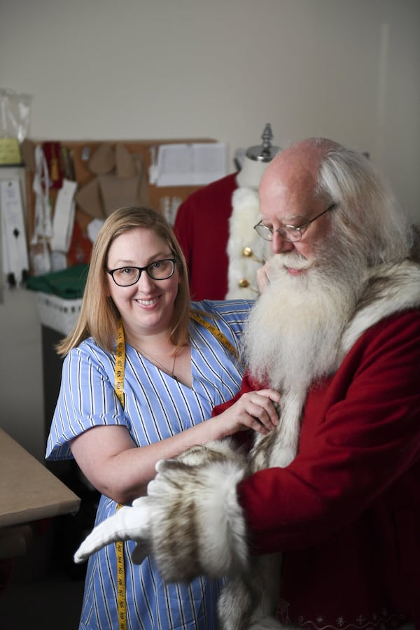 Elizabeth Rasmusson helps Santa get ready for Christmas. Ramusson and her business partner Brittany Johnson create bespoke outfits for professional Santa Clauses. CONTRIBUTED: BRANT SANDERLIN