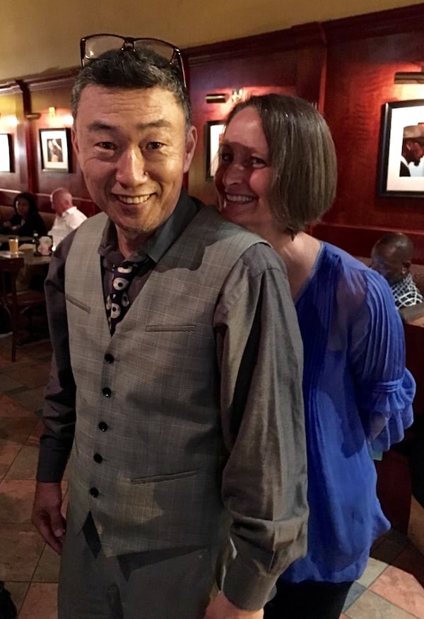 Sam Yi with friend and jazz vocalist Virginia Schenck in Yi's club Churchill Grounds.