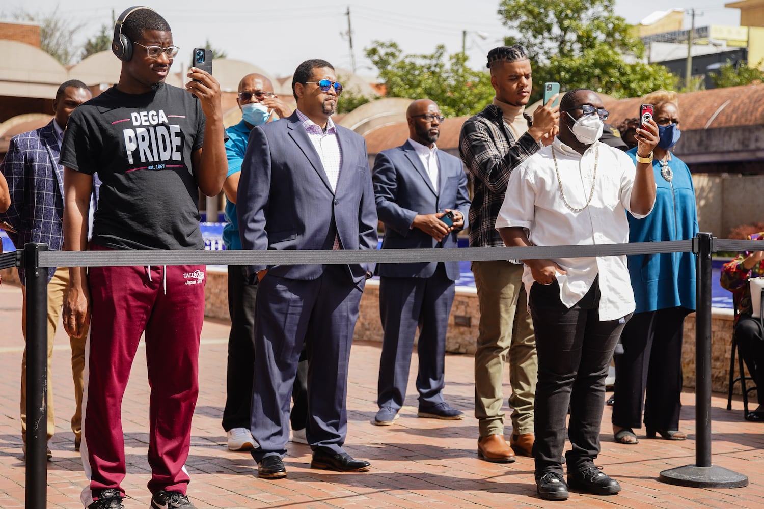 People listen to a speaker at a wreath laying ceremony at The King Center on the 54th anniversary of the assassination of Dr. Martin Luther King Jr., on Monday, April 4, 2022, in Atlanta. (Elijah Nouvelage/Special to the Atlanta Journal-Constitution)