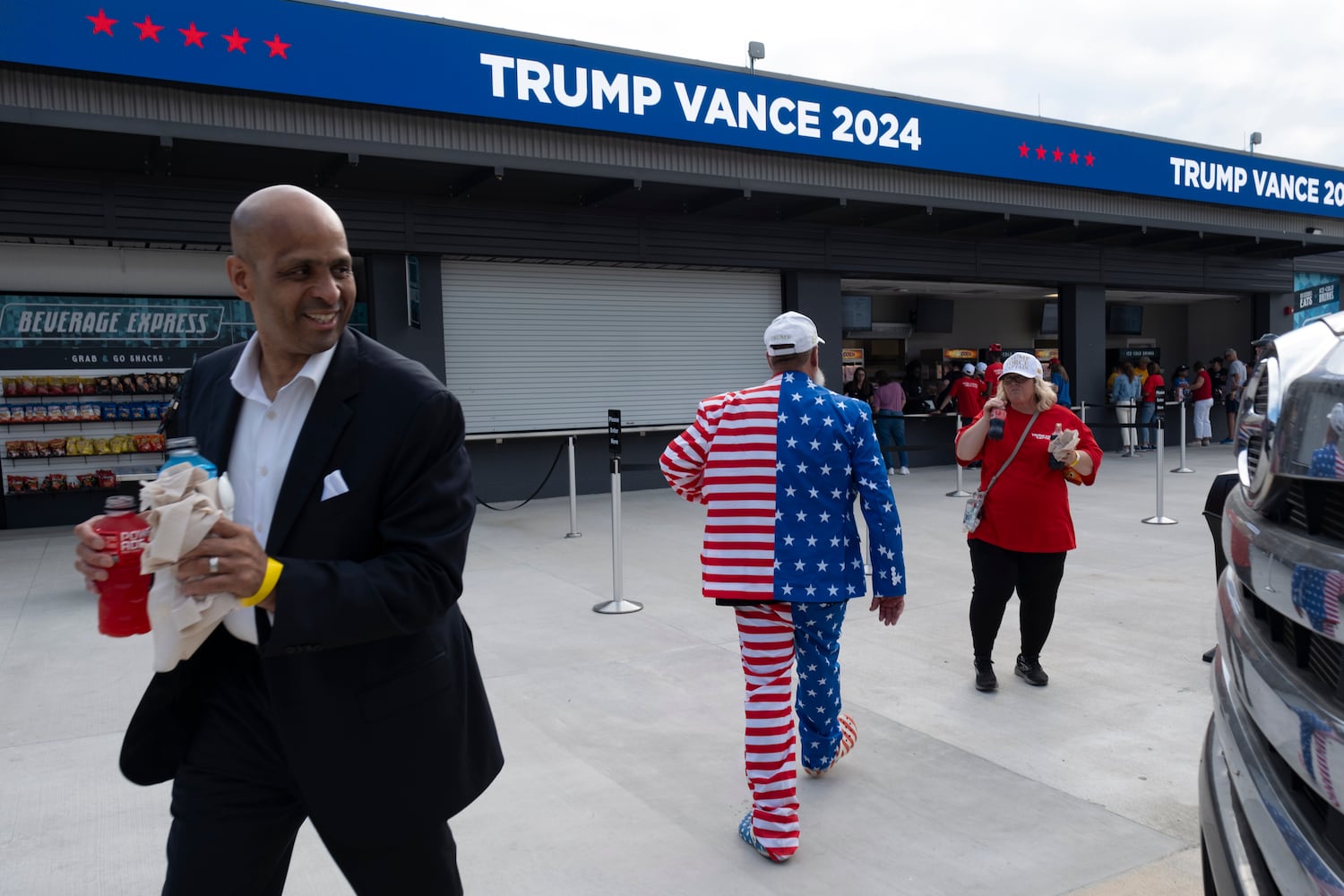 Shawn Cox of Ocilla sports a U.S. Flag suit at the  rally for former President Donald Trump in Macon on Sunday, Nov. 3, 2024.   Ben Gray for the Atlanta Journal-Constitution