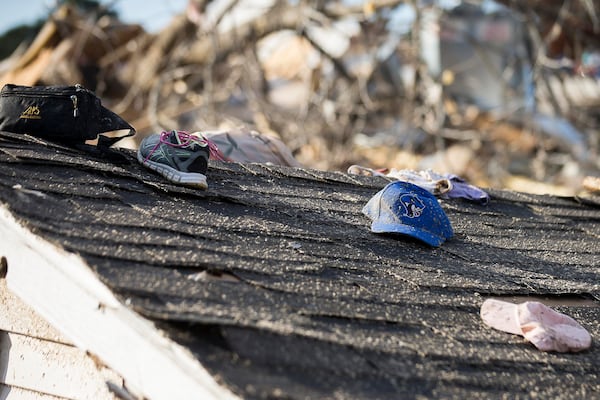 Personal items sit atop a roof the was ripped apart in a local residence in Talbotton, Monday, March  4, 2019. Keith Stellman, head forecaster for the National Weather Service, said during the presser that the path of destruction in the town looked to be caused by an EF2 tornado, although that wasn't confirmed during the governor's tour.  (ALYSSA POINTER/ALYSSA.POINTER@AJC.COM)