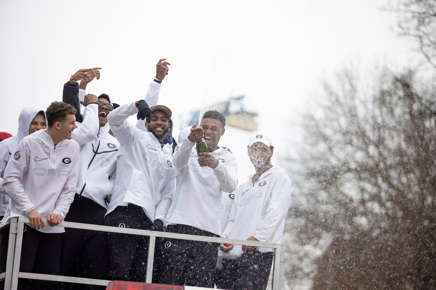 UGA players spray champagne during the UGA National Championship Celebration Parade in Athens, GA., on Saturday, January 15, 2022. (Photo/ Jenn Finch)