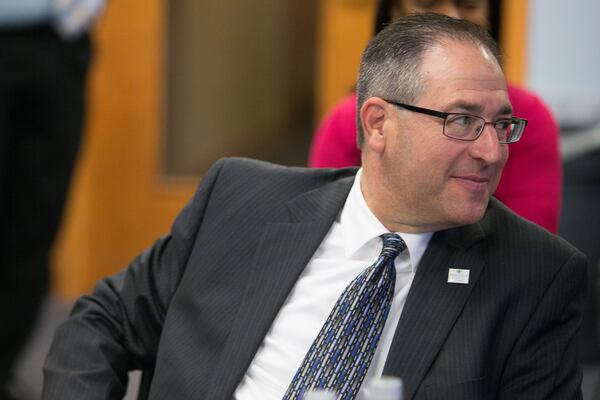 Johns Creek Mayor Mike Bodker sits during a county meeting at the Fulton County Government Center, Monday, Dec. 14, 2015, in Atlanta. BRANDEN CAMP/SPECIAL